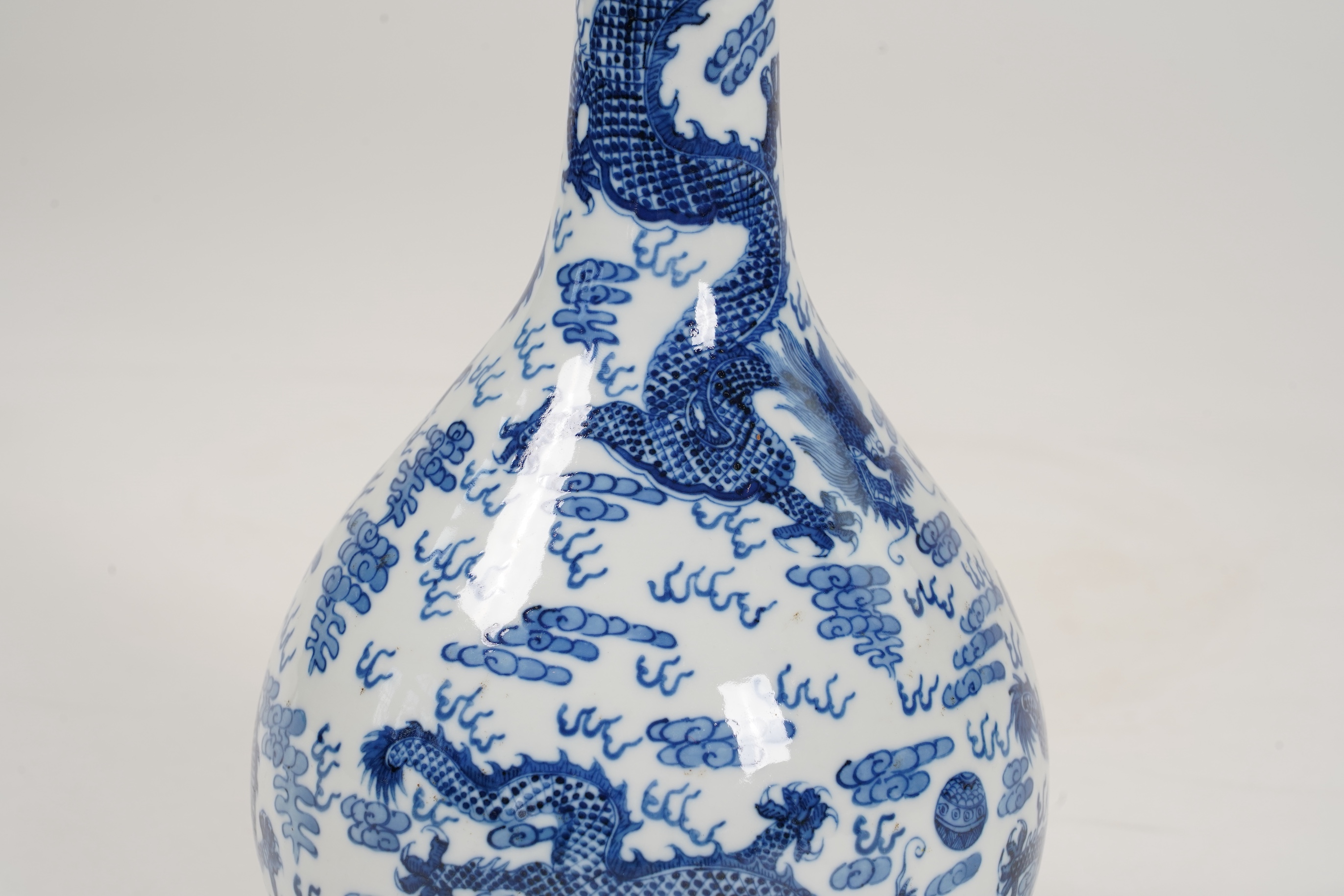 A Chinese blue and white 'dragon' bottle vase, 19th/20th century